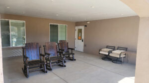 Sit out in the covered patio and enjoy the sunshine and shade at the BeeHive Home in Raton